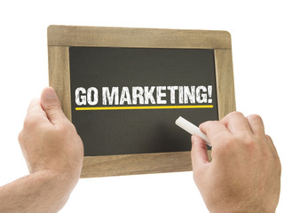 Go Marketing! Hand writing on chalkboard