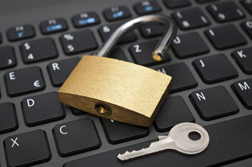 Cyber safety concept - lock on computer keyboard