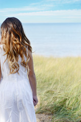 young girl looking at ocean