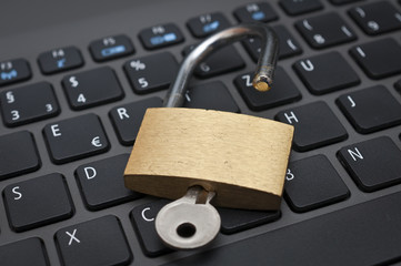 Cyber safety concept - lock on computer keyboard