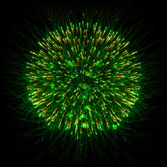 beautiful green fireworks in the shape of a ball isolated on black