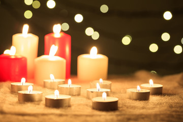 Fototapeta na wymiar Candles on a dark background