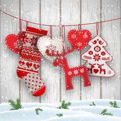 Christmas folklore decorations hanging in front of white wooden wall, illustration