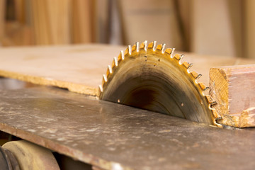 Carpenter tools on wooden table with sawdust. Circular Saw. Carpenter workplace top view
