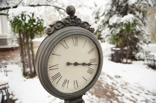 clock on the snowy background