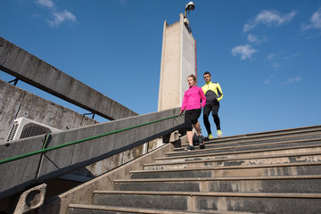 young  couple jogging on steps