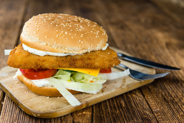 Fish Burger on wooden background