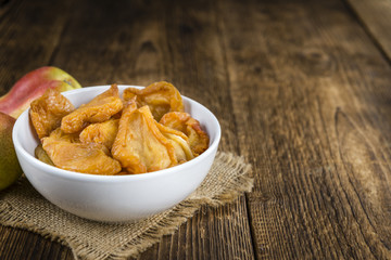 Wooden table with dried Pears (selective focus)