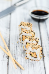 Sushi on a wooden table (selective focus)