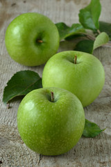 Green apples on grey background