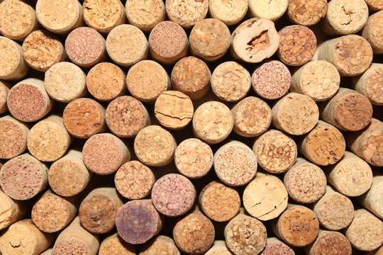 many different wine corks in the background