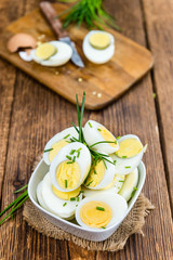 Halved Eggs on wooden background