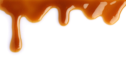 Melted caramel dripping - obrazy, fototapety, plakaty