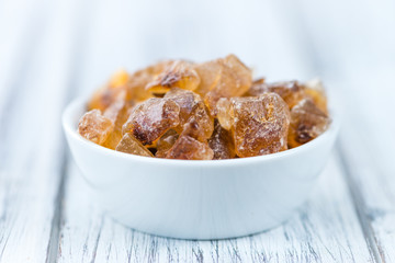 Brown Rock Candy on wooden background