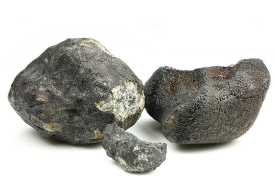 fragments of the Chelyabinsk meteorite (fallen 15 February 2013) isolated on white background