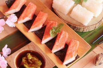 Crab stick with wasabi sauce and making sushi.