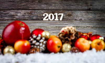 Christmas Decoration Over Wooden Background and fruits. Xmas card and gift. Winter holidays theme. Empty space for text.