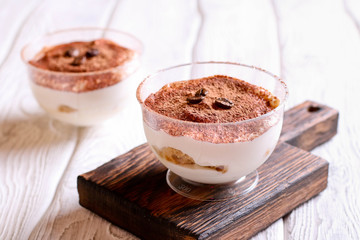 Traditional Italian dessert tiramisu in a glass