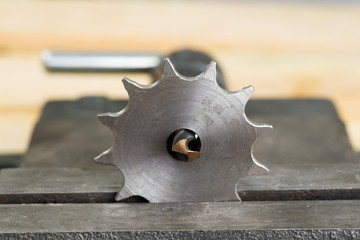 The vise to clamp on a wooden desktop environment tools