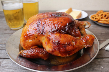 Chicken roasted and pretzels with beer in party