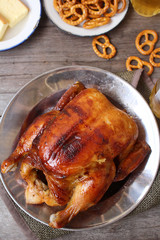 Chicken roasted and pretzels with beer in party