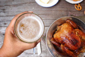 Chicken roasted and pretzels with beer in party