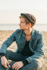 happy young man in sea and sunrise