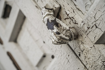 hand shaped knob of a wooden door