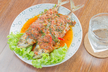 lose up fried Mackerel and chili sauce on wood
