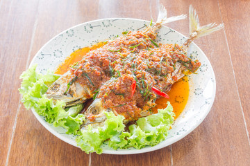 lose up fried Mackerel and chili sauce on wood