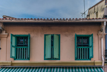 Windows and balconies in typical colonial architecture in Singap