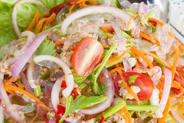 spicy noodle salad, spicy vermicelli salad (yum woon sen) on disc. Thai food.