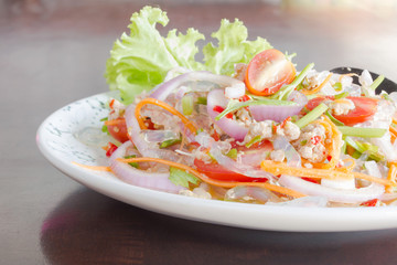 spicy noodle salad, spicy vermicelli salad (yum woon sen) on disc. Thai food.