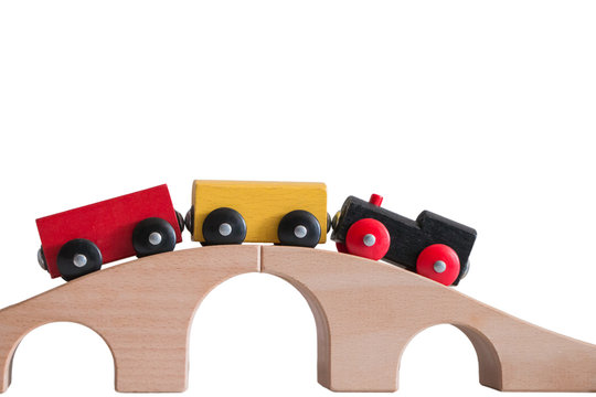 Colorful Train Toy On Wooden Bridge With White Background