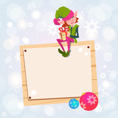 Christmas Elf Girl Cartoon Character Santa Helper Sit On Empty Sign Board Banner Flat Vector Illustration