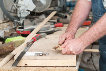 Carpenter tools on wooden table with sawdust. Circular Saw. Cutting a wooden plank