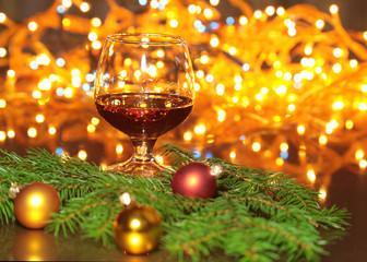 christmas photo cognac glass in front of bokeh background