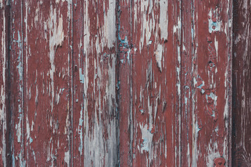 Peeling brown paint on weathered wood texture