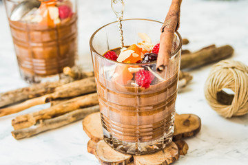 Pumpkin chocolate mousse with cinnamon, almonds and berries
