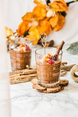 Pumpkin chocolate mousse with cinnamon, almonds and berries