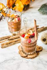 Pumpkin chocolate mousse with cinnamon, almonds and berries