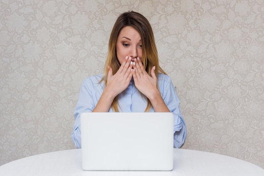 Girl shocked and surprised look in laptop