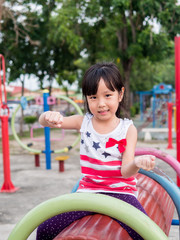 Fototapeta na wymiar Happy asian baby child playing on playground