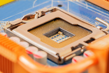 Empty CPU socket on motherboard. Selective focus.