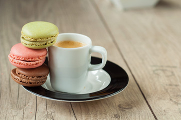 Colorful macaroons over turquoise wood backround