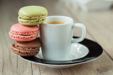 Colorful macaroons over turquoise wood backround