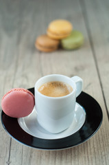 Colorful macaroons over turquoise wood backround