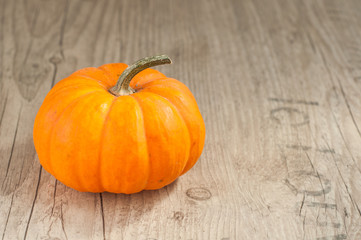 pumpin on old wooden background