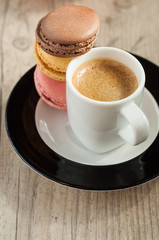 Colorful macaroons over turquoise wood backround