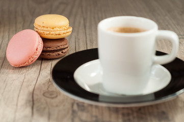 Colorful macaroons over turquoise wood backround